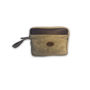 Waxed canvas IPAD pouch with brown leather patch on a white background